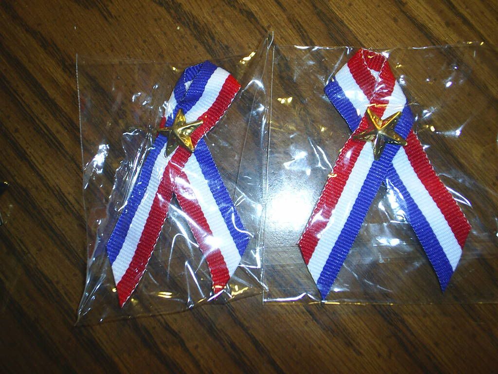 red white blue ribbons with star pin